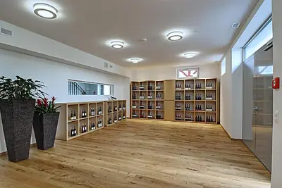 a large room with a large library with book shelves at Gasthof Eisenbahn in Weinfelden