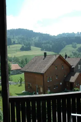 a view from the balcony of a house with a mountain at Landgasthof Sternen in Bühler