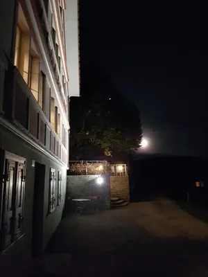 a dark alley with a building at night at Gasthaus Bären Schlatt in Appenzell
