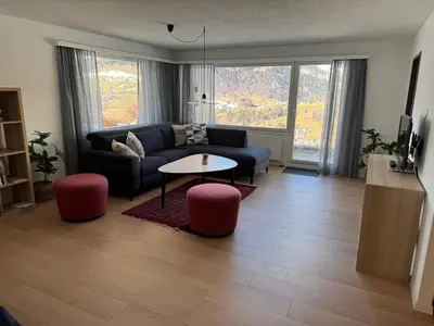 a living room with a couch and a table at Jizerka in Unterwasser