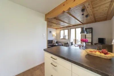 a kitchen with a bowl of fruit on a counter at Schönau in Wildhaus