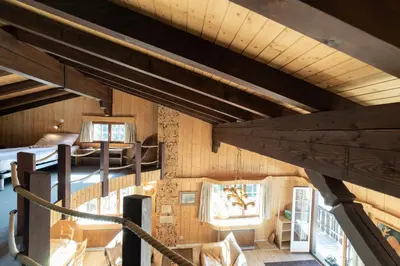 an attic view of a cabin with wooden walls at Tanzhaus in Wildhaus