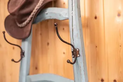 a wooden door with a hat hanging on it at Hof-Tschannen in Lengwil