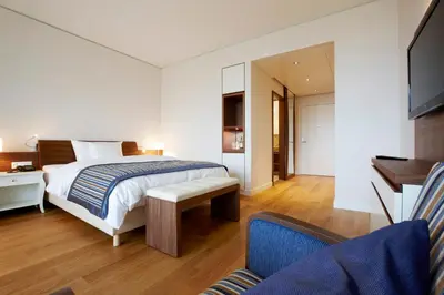 a hotel room with a bed and a couch at Oberwaid - Das Hotel. in St. Gallen