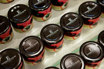 a bunch of jars of jam on a shelf at Einstein St. Gallen in St. Gallen