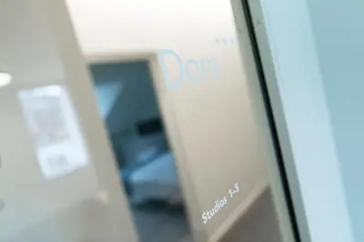 a glass door with a dont sign on it at Dom Studios in St. Gallen