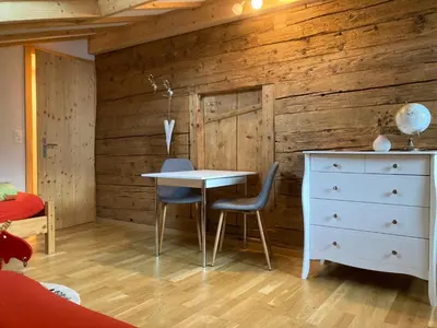 a room with a table and two chairs and a dresser at Wies in Stein