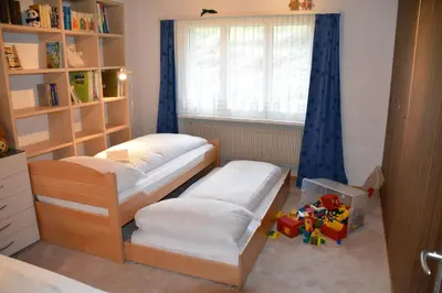 a bedroom with two bunk beds and a window at Jambo Pua in Alt Sankt Johann