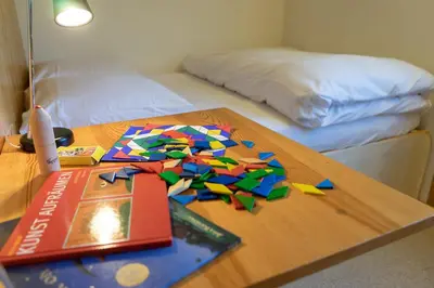 a table with colorful paper on it with a book at Frühweid in Unterwasser