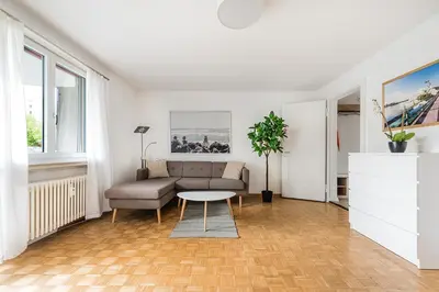 a living room with a couch and a table at SOHO G !Gratis Parken, Free Parking! in Kreuzlingen