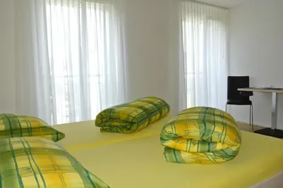 a room with two pillows sitting on a table at Hotel Garni Bären Bazenheid in Bazenheid