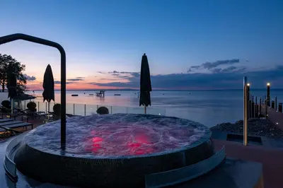 a jacuzzi tub with a view of the ocean at Bad Horn - Hotel & Spa in Horn
