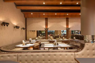 a restaurant with tables and chairs in a room at Hotel Walhalla in St. Gallen