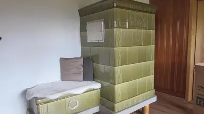 a small room with a green tiled wall at Billenberghof in St. Gallen