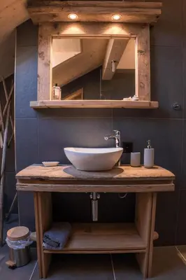 a bathroom with a sink and a mirror at NEU renoviert - Bitzi Appenzell – Mit Aussicht in Appenzell