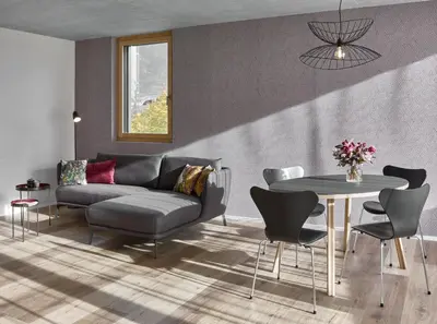 a living room with a couch and a table at BoHo by Maier - kontaktloser Check-In in Buchs