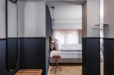 a bedroom with a bed and a window at Sorell Boutique-Hotel City Weissenstein St Gallen in St. Gallen