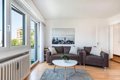 a living room with a couch and a table at SOHO 9 !Gratis Parken, Free Parking! in Kreuzlingen