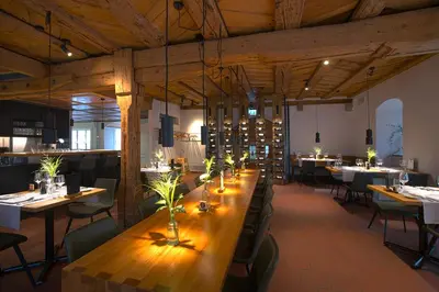 a dining room with a long table and chairs at Gasthaus zum Trauben in Weinfelden