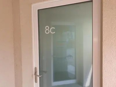 a glass door with the number on it at Schönes Studio in Arbon am Bodensee Neu Klimatisiert ! in Arbon