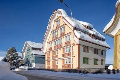 a building with snow on top of it at Blattenheimat - im traditionellen Appenzeller Haus in Appenzell