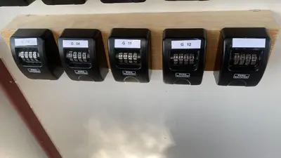 a row of four electronic clocks sitting on a table at Blattenheimat - im traditionellen Appenzeller Haus in Appenzell