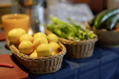 two baskets of fruit and vegetables on a table at Vegan Health Hotel Sonnenberg in Schwellbrunn