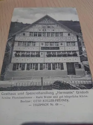 a book with a picture of a building at Alpen-Paradies Edelweiss in Urnäsch