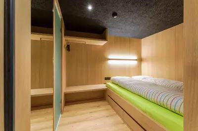 a sauna with a green bench in a room at Gasthaus Hof in Appenzell