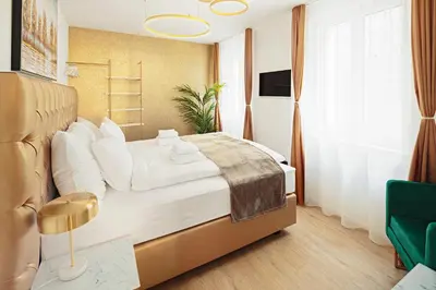 a bedroom with a large bed and a window at VISIMO Apartments Mühlensteg St Gallen - Elegant Quiet Central in St. Gallen