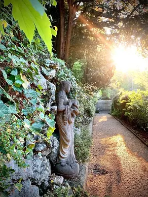 a statue of a woman holding a child at Villa Bergruh in St. Gallen