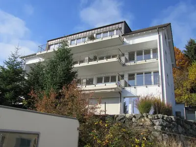 a white building on top of a hill at Hotel Rössli in Zuzwil