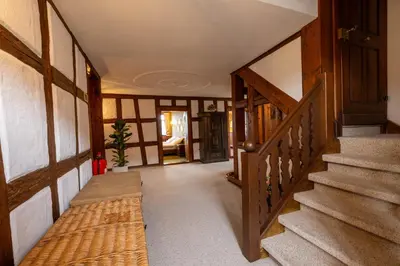 a hallway with stairs in a house at Schloessli Herrenhof in Herrenhof
