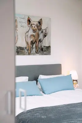 two dogs standing on a bed in a bedroom at Hotel & Restaurant Nollen in Hosenruck